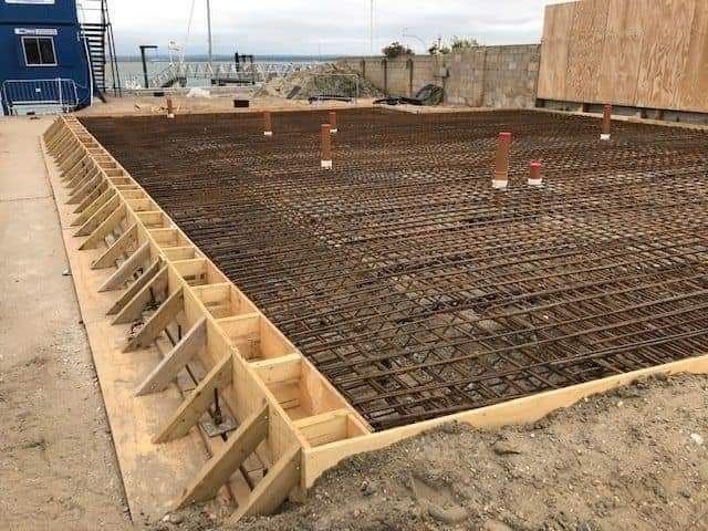 Reinforced concrete strip footings set out for a building foundation